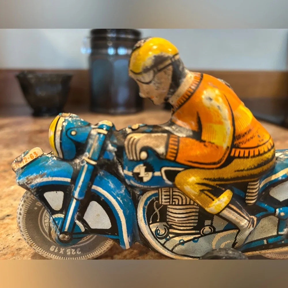Tin Lithograph Friction Drive Ballon Cordatic toy cycle EN-12-63 Vtg 1950 Era.
